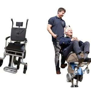 A bloke helps a senior with a stair climber for seniors ascend. Another unoccupied stair climber sits nearby.