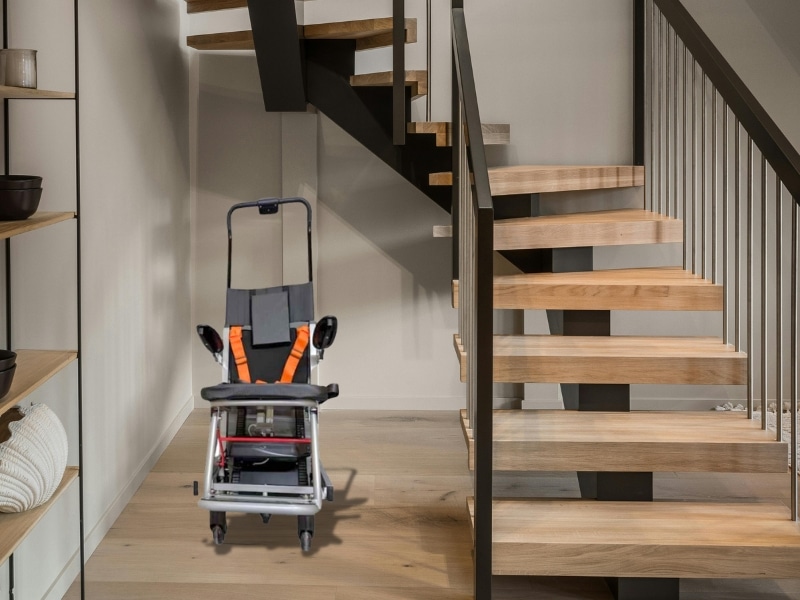 Modern lift for stairs in house installed near wooden staircase for safe accessibility.