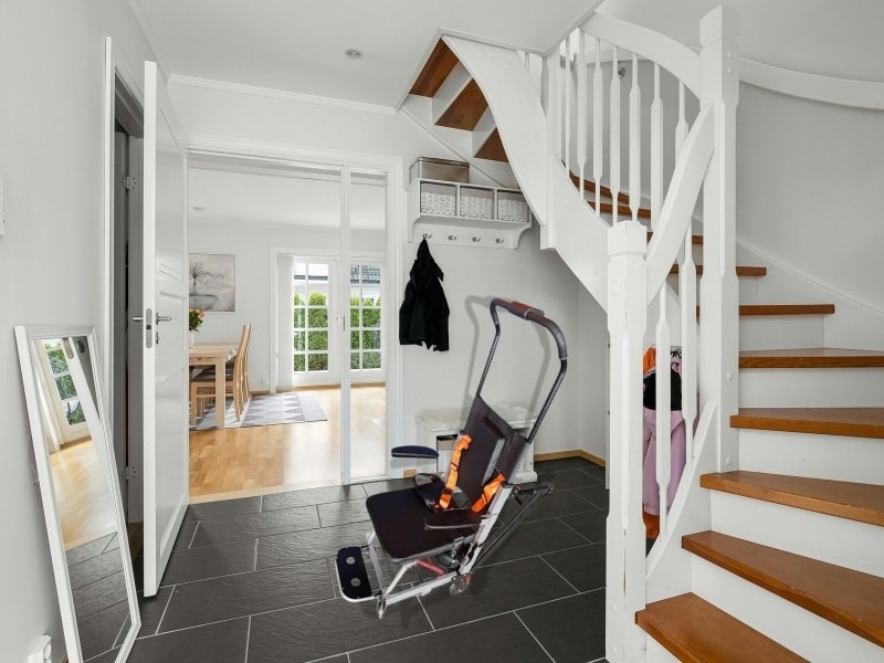 Modern hallway showing chair lifts for stairs designed for safe mobility in multi-level homes.