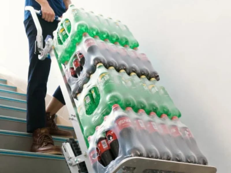 stair trolley hire used to move heavy drink cartons up stairs easily.