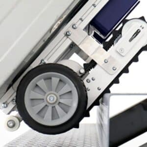 stair trolley hire showing close-up of wheels gripping stairs for safe heavy lifting.